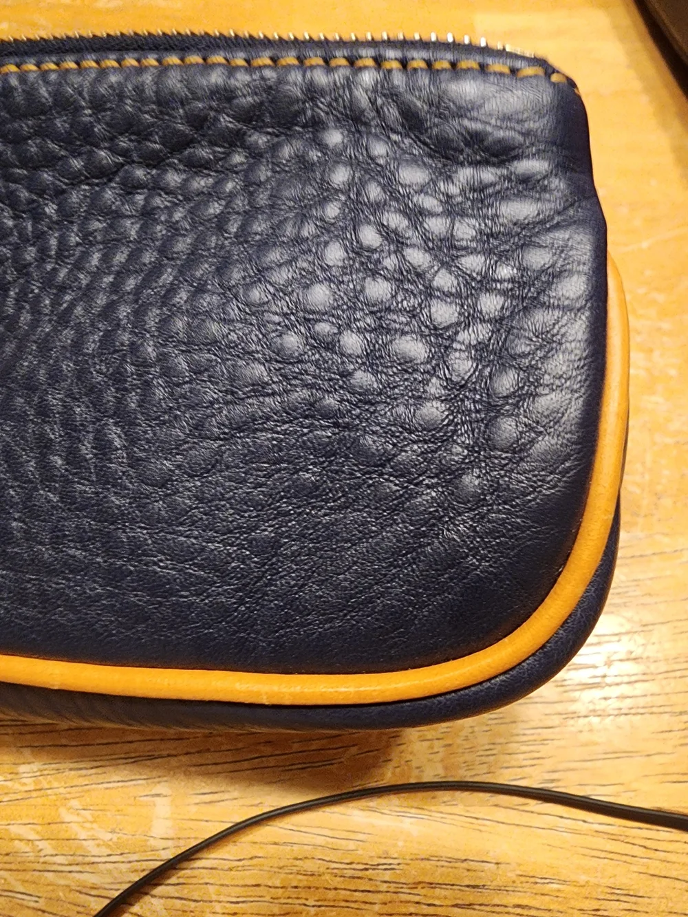 Dooney & Bourke Pebble Grain Slim Cosmetic slim pouch in navy blue Leather